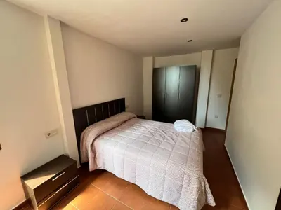 Cama o camas de una habitación en Apartamentos Raíces