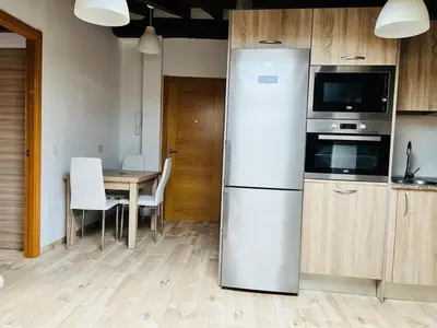 Una cocina o zona de cocina en Apartamentos Raíces