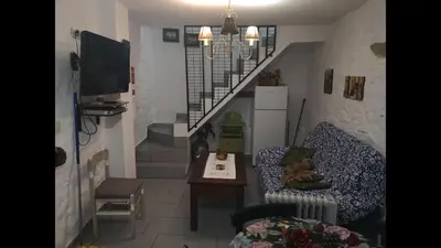Una televisión o centro de entretenimiento en Rural House Mirador del Castillo