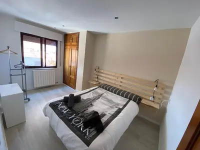Cama o camas de una habitación en ATICO Romo