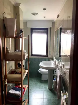 Un baño de ATICO Romo
