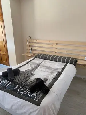 Cama o camas de una habitación en ATICO Romo
