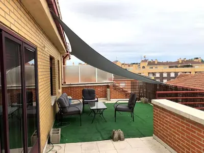 Un balcón o terraza de ATICO Romo