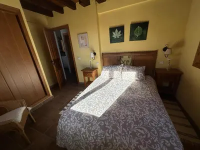 Cama o camas de una habitación en Casa Rural Naranja