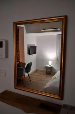 Una televisión o centro de entretenimiento en II Precioso apartamento con vistas a la Catedral