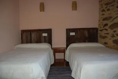 Cama o camas de una habitación en Casita del jardin