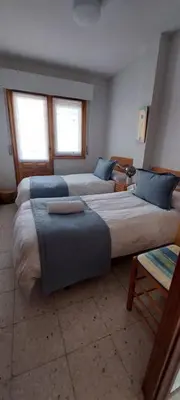 Cama o camas de una habitación en La lechuza blanca