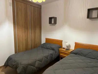 Cama o camas de una habitación en El Balcón de la Covatilla