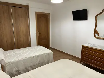 Cama o camas de una habitación en El Balcón de la Covatilla