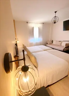 Cama o camas de una habitación en Hotel Rural Candela y Plata