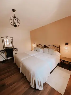 Cama o camas de una habitación en Hotel Rural Candela y Plata