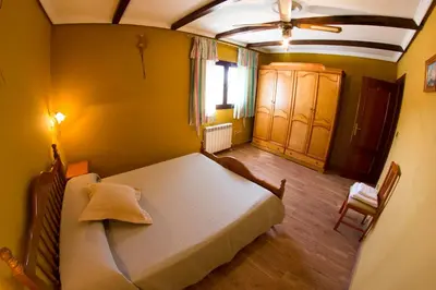 Cama o camas de una habitación en La Charca de la Dehesa