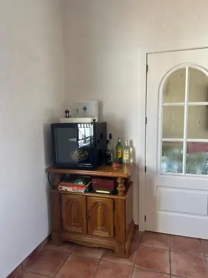 Una televisión o centro de entretenimiento en Casa Rural El Limonero