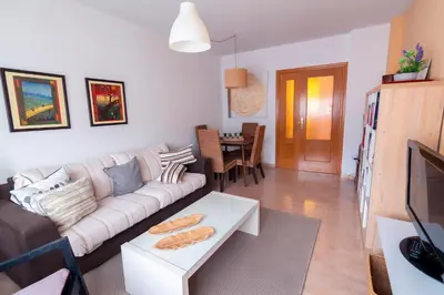 Una televisión o centro de entretenimiento en Apartamento El Castillo