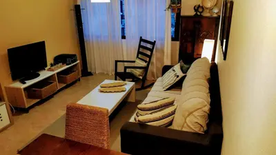 Una televisión o centro de entretenimiento en Apartamento El Castillo