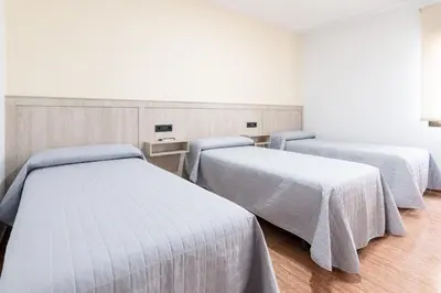 Cama o camas de una habitación en Hostal Viñuela