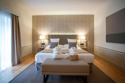 Cama o camas de una habitación en Hospes Palacio de Arenales & Spa