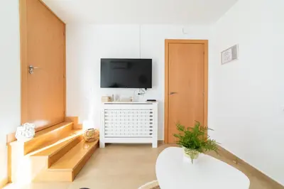 Una televisión o centro de entretenimiento en Apartamentos Turísticos Casa Morocho
