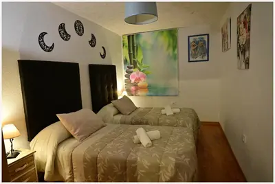 Cama o camas de una habitación en apartamentos MERIDA LÚDICA parking gratis