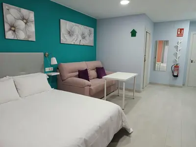 Cama o camas de una habitación en Estudios La Casina