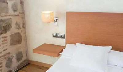 Cama o camas de una habitación en Hotel Las Leyendas