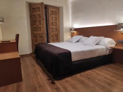 Cama o camas de una habitación en Hotel Las Leyendas