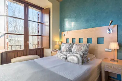 Cama o camas de una habitación en Izan Puerta de Gredos
