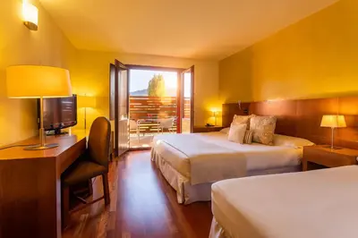 Cama o camas de una habitación en Izan Puerta de Gredos