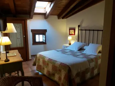 Cama o camas de una habitación en Hostal Rural Luna y Hostal Rural Lunaposada