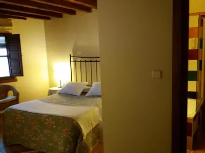 Cama o camas de una habitación en Hostal Rural Luna y Hostal Rural Lunaposada