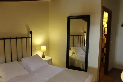 Cama o camas de una habitación en Hostal Rural Luna y Hostal Rural Lunaposada