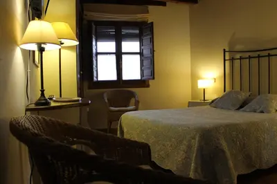 Cama o camas de una habitación en Hostal Rural Luna y Hostal Rural Lunaposada