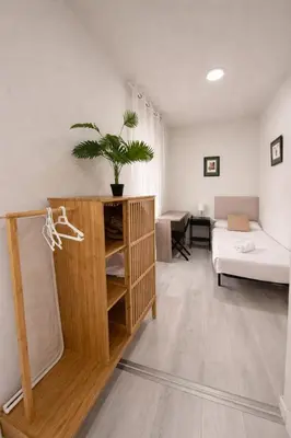 Cama o camas de una habitación en Muralla Home