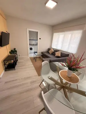 Una televisión o centro de entretenimiento en Muralla Home