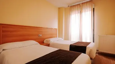 Cama o camas de una habitación en JCH Congreso Apartamentos