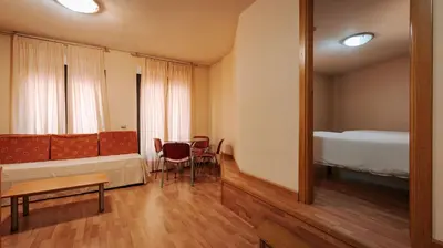 Cama o camas de una habitación en JCH Congreso Apartamentos