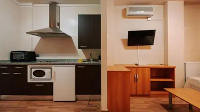 Una cocina o zona de cocina en JCH Congreso Apartamentos