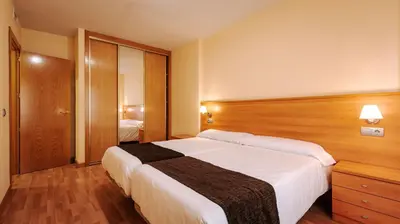 Cama o camas de una habitación en JCH Congreso Apartamentos