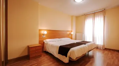 Cama o camas de una habitación en JCH Congreso Apartamentos