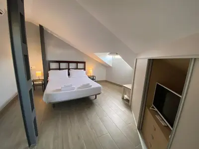 Cama o camas de una habitación en V Apartamento junto a PlazaMayor
