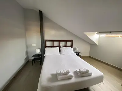 Cama o camas de una habitación en V Apartamento junto a PlazaMayor