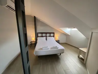 Cama o camas de una habitación en V Apartamento junto a PlazaMayor