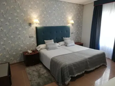 Cama o camas de una habitación en Hotel Las Moradas