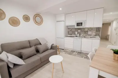 Una cocina o zona de cocina en Apartamentos Turísticos A Tu Verita