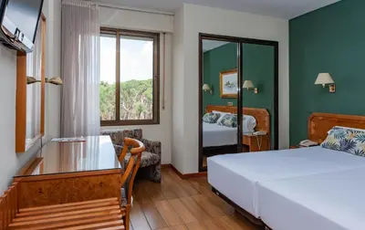 Cama o camas de una habitación en Hotel Don Carmelo