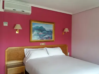 Cama o camas de una habitación en Hotel Don Carmelo