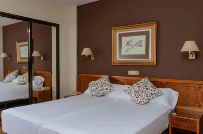 Cama o camas de una habitación en Hotel Don Carmelo