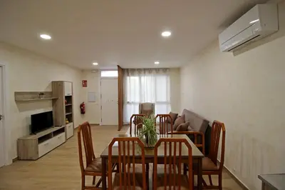Una televisión o centro de entretenimiento en Apartamento turístico la Vera