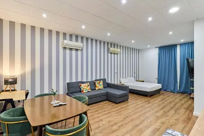 Zona de estar de Apartamentos Margarita by gaiarooms