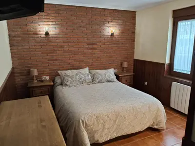 Cama o camas de una habitación en VuT Casa Fabe12